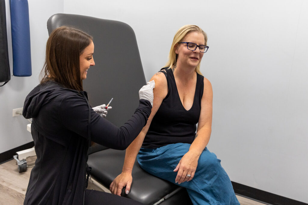 A woman receiving a Semaglutide injection in Highland Park